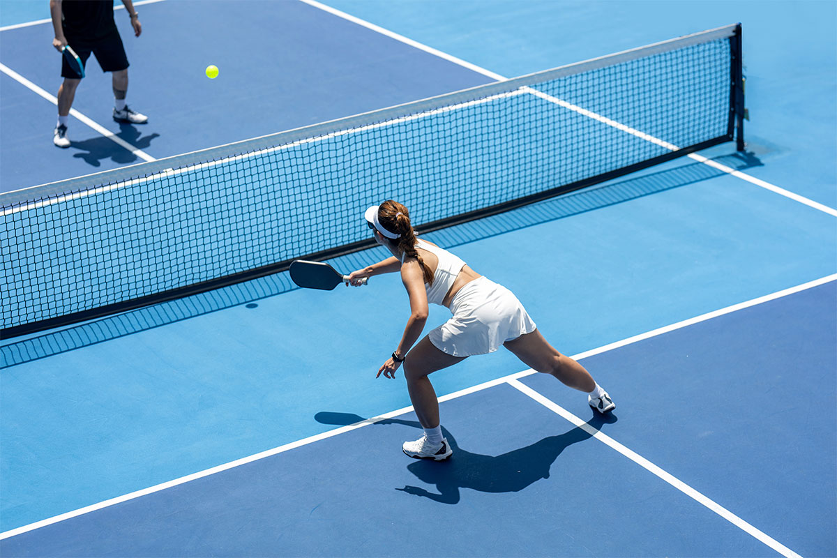 Woman playing pickleball after recovering from back pain with endoscopic discectomy in Parsippany-Troy Hills.